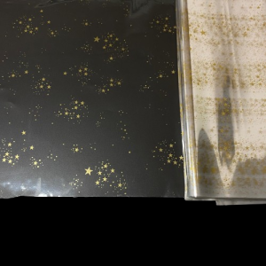 FOGLI CELLOPHANE TRASP. STAMPATO 30MY CM 100X130 50PZ stelle-oro (Cod. 106-17)